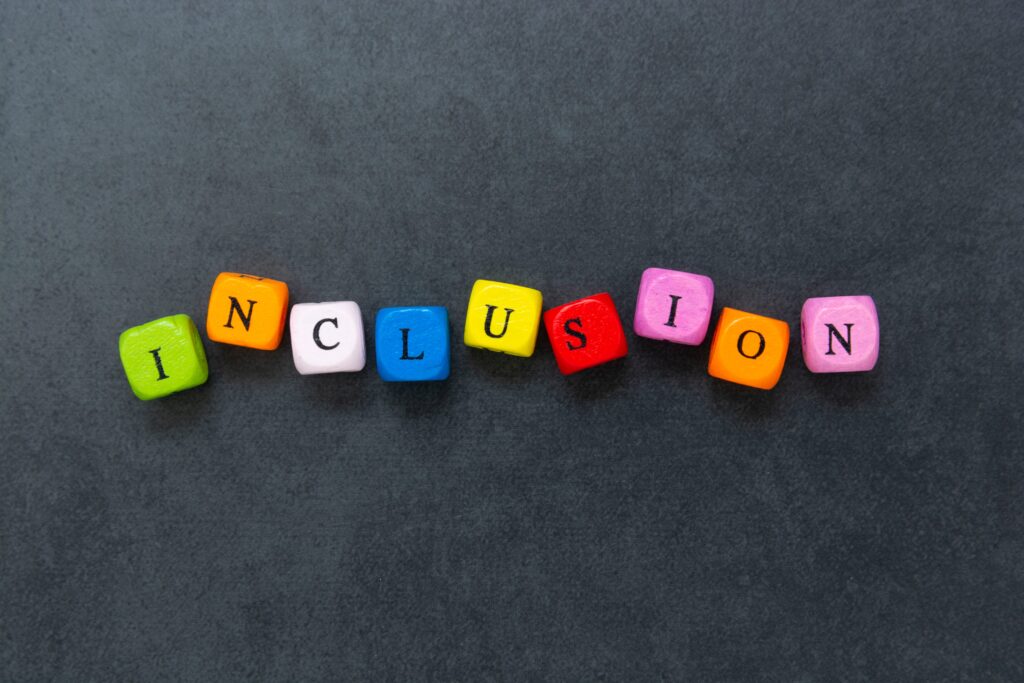 Multicolored cubes with the word inclusion
